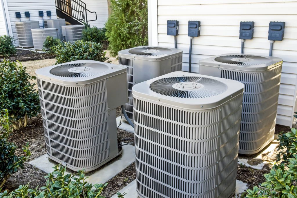 Group of Air Conditioning Units At Apartment Complex